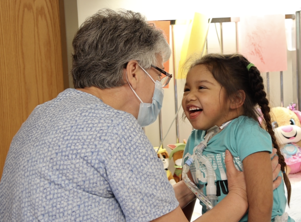 CNA Helping Patient