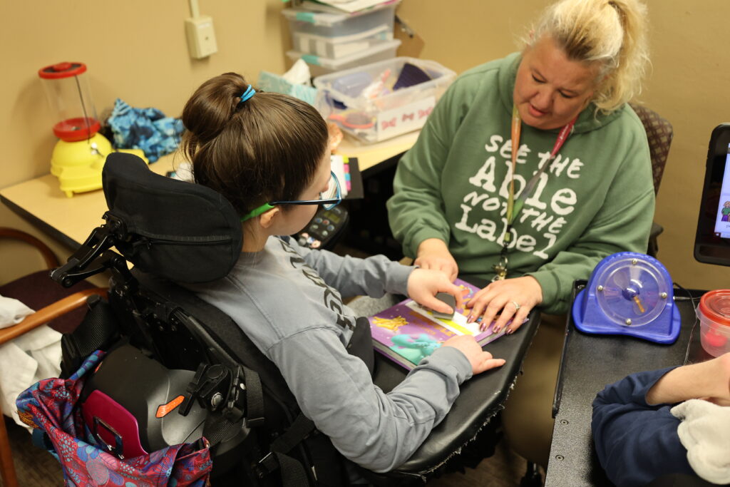 Teaching Assistant helping student during class.